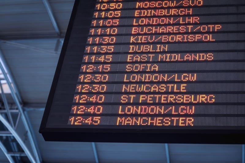 Airport departure board for trip cancellation cover